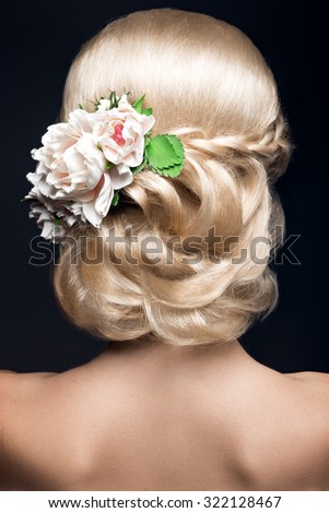 Beautiful blond woman in image of the bride with flowers. Beauty face and Hairstyle  back view