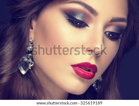 Beautiful woman with arabic make-up, red lips and curls. Beauty face. Insta Color