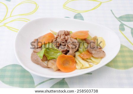 baked meat and vegetables dinner dish on tablecloth