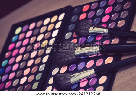 Vintage looking colorful eye shadow with professional makeup brush