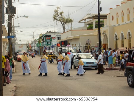 COZUMEL, MEXICO - APRIL 8: Procession of people pass through the city on April 8, 2007 during Easter Mass celebrations.  It is an annual Easter Sunday ceremony in Cozumel, Mexico