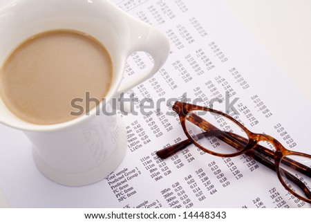 Calculating finances and bills with coffee and glasses