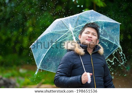 man is playing with rain
