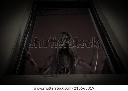 Zombie girl in haunted house scary