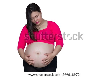 Happy smiling Pregnant Woman touching her Belly. Pregnancy concept. Mom Expecting Baby. Beautiful