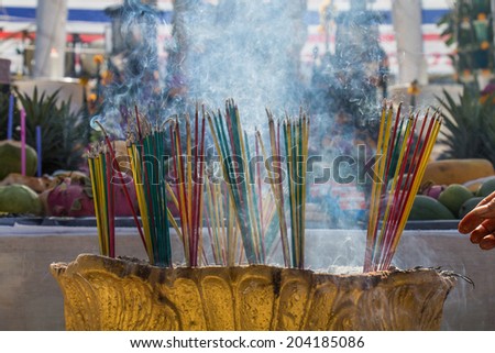 Burning the incense to worship the sacred