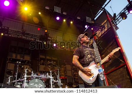 NAMPA, IDAHO - SEPTEMBER 25:  Aaron Lewis  plays his Fender guitar while he sings into the microphone at Rockstar Uproar Festival on September 25 2012 in Nampa, Idaho.
