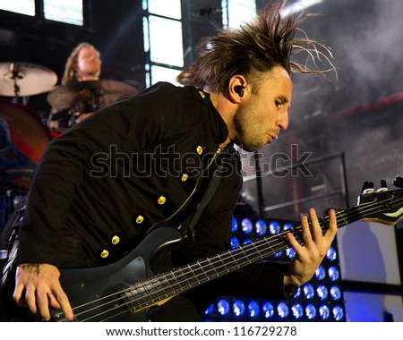 NAMPA, IDAHO - SEPTEMBER 25 : Bassist Eric Bass from shinedown gets busy with his bass guitar at the Rockstar Uproar Festival on September 25, 2012 in Nampa, Idaho.
