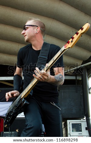 NAMPA, IDAHO - SEPTEMBER 25 : Joel Bruyere of Thousand Foot Krutch plays his bass at Rockstar Uproar Festival on September 25, 2012 in Nampa, Idaho.