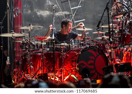 NAMPA, IDAHO - SEPTEMBER 25 : Godsmack singer Sully Erna beats the drums at the Rockstar Uproar Festival on September 25, 2012 in Nampa, Idaho.