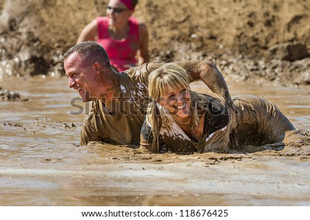 BOISE, IDAHO - AUGUST 25: Unidentified people play in the mud at the Dirty Dash August 25 2012 in Boise, Idaho