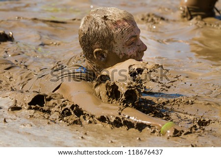 BOISE, IDAHO - AUGUST 25: Unidentified man splashes in the pool at the Dirty Dash August 25 2012 in Boise, Idaho
