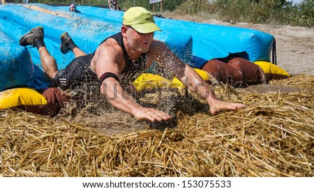 BOISE, IDAHO/USA - AUGUST 11: Unidentified man speeds into the hay at the The Dirty Dash in Boise, Idaho on August 11, 2013