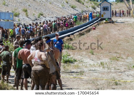 BOISE, IDAHO/USA - AUGUST 10, 2013: Long line of people wait to get to the slide at the The Dirty Dash