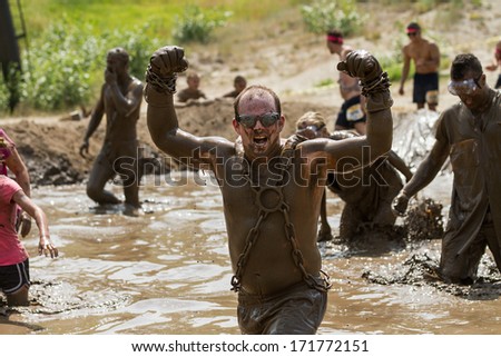 BOISE, IDAHO/USA - AUGUST 11, 2013: Unidentified man shows in strength at the dirty dash