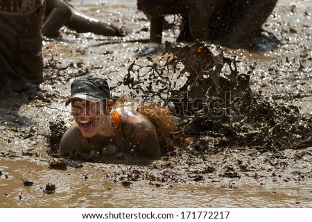 BOISE, IDAHO/USA - AUGUST 11, 2013: Unidentified person makes a mess in the mud pit after falling at the dirty dash