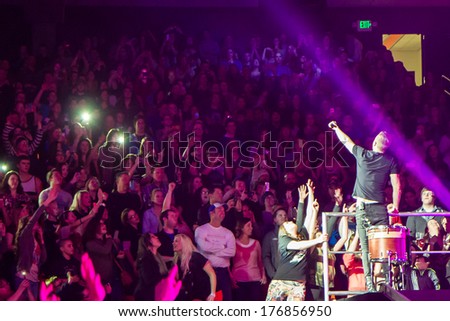 BOISE, IDAHO/USA - FEBRUARY 8, 2013: Dan Reynolds of Imagine Dragons gets close to his fans during his performance