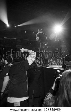 BOISE, IDAHO/USA - FEBRUARY 8, 2013: Photographers capture the action during with Imagine Dragons on stage during the Night Visions tour