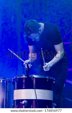 BOISE, IDAHO/USA - FEBRUARY 8, 2013: Dan Reynolds plays the drugs on stage during the night visions tour featuring Imagine Dragons