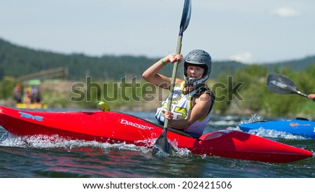 CASCADE, IDAHO/USA - JUNE 21, 2014: 183 Works her Kayak through the river at the Payette River Games