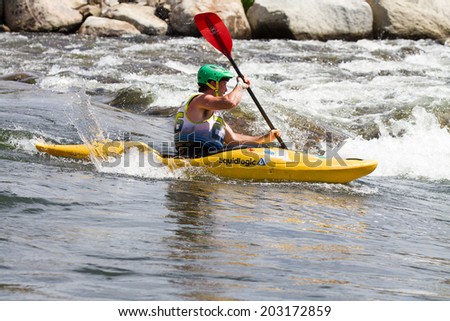 CASCADE, IDAHO/USA - JUNE 21, 2014: Man kayaking down the river at the Payette River Games in Cascade, Idaho