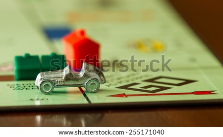 BOISE, IDAHO - NOVEMBER 18, 2012: Car from the game Monopoly speeding past. Game was made by Parker Brothers now owned by Hasbro