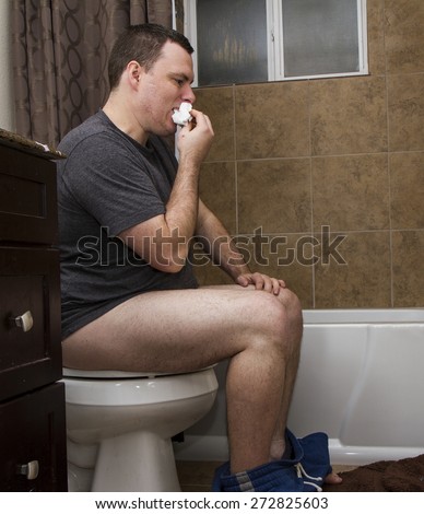 very disgusting man eating his pooped toilet paper