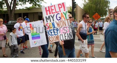 stock-photo-boise-idaho-usa-june-signs-being-held-during-the-boise-pride-festival-parade-440103199.jpg
