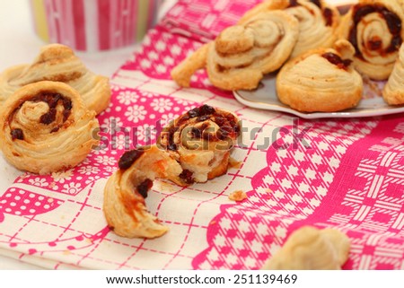 still life from puff dried cherry cakes and cinnamon