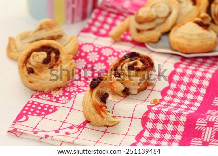 still life from puff dried cherry cakes and cinnamon