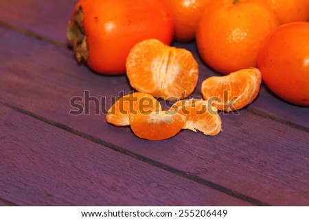 background from orange fruit on violet boards
