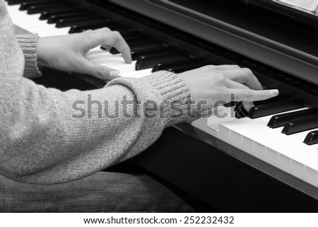 Pianist. Hands of boy,which studies play on the piano.