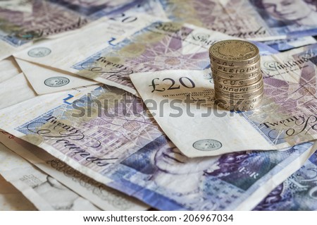 Pile of money and stacked coins british pounds sterling gbp for business and finance