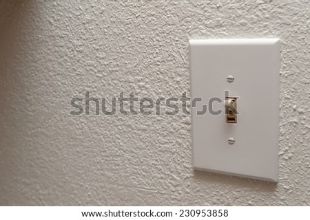 Light switch on the wall. selective focus