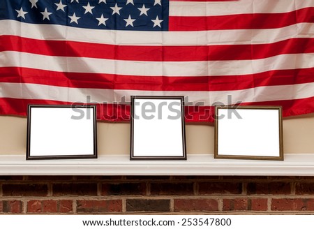 Three blank photo frames on a shelf with american flag background