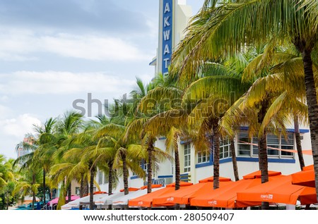 Miami Beach, Florida, US - May 17, 2015 - Coconut trees and hotels along the ocean coast at south Miami beach