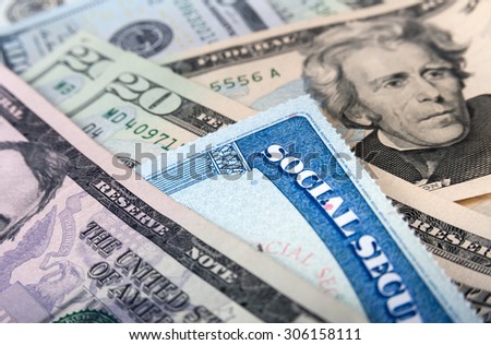 Social security card and American money dollar bills close up concept