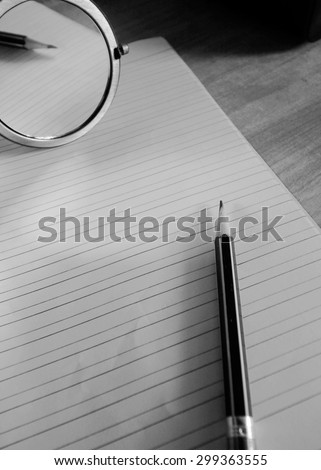 pencil lying on a blank paper with a mirror image, Creative work, writing, drawing etc. blackandwhite mood