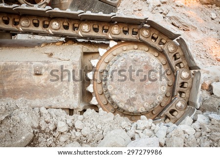 Well used excavator tracks closeup