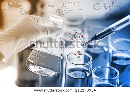 Researcher is dropping the reagent into test tube for reaction testing in chemical laboratory.