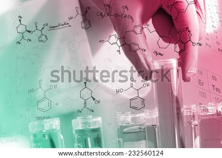 Gloved hand holding the test tubes, with chemical equations background,  in the laboratory