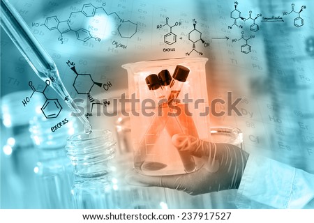 Gloved hand hold a beaker, with chemical equations background, in laboratory room