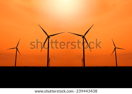 Wind turbines silhouette at sunset