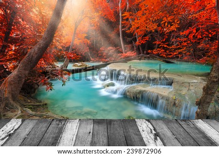 Beautiful waterfall in deep forest and wood pier at Kanchanaburi, Thailand