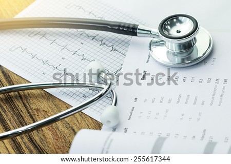 Stethoscope and medical check-up report for healthcare concept