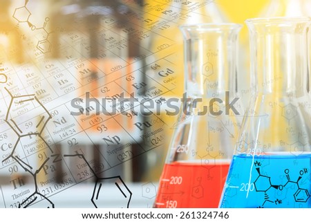 Laboratory glassware, flasks with clear solution with periodic table and chemical structure background at laboratory