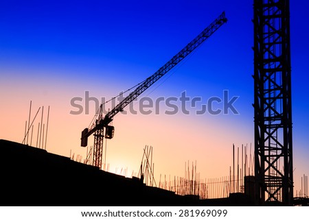 Construction site silhouette at sunset