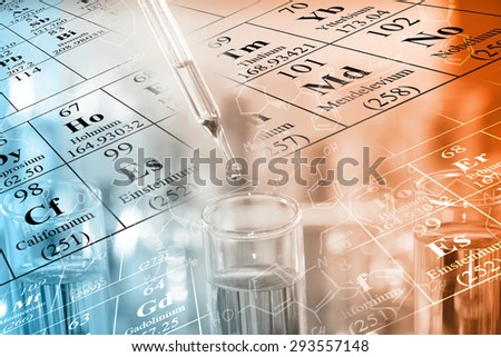 A researcher dropping the clear reagent into test tube with periodic table and chemical equations background, for reaction testing in chemical laboratory.