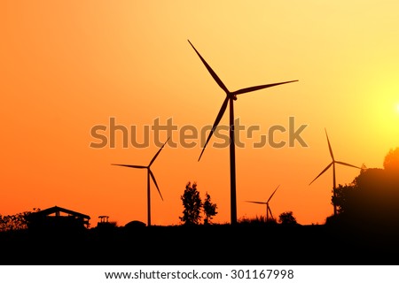 Wind turbines, wind farms silhouette at sunset in Thailand