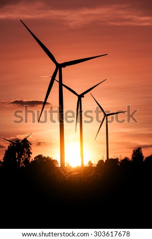 Wind turbines, wind farms silhouette at sunset in Thailand